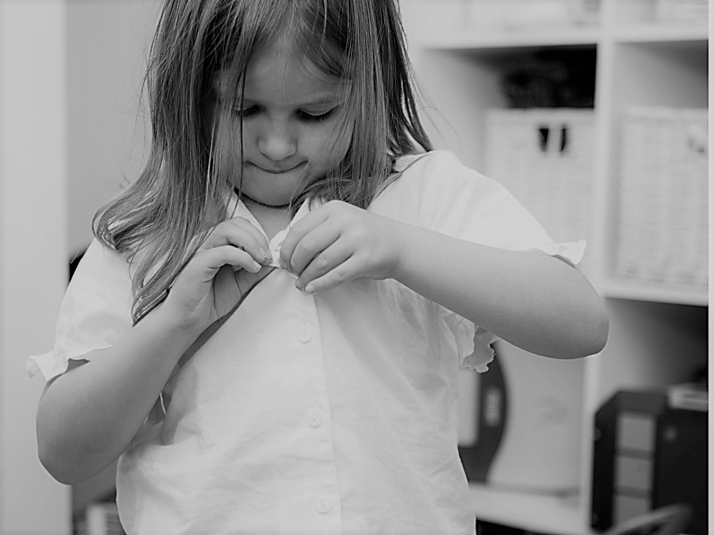 girl-buttoning-white-shirt-picture-id134574295